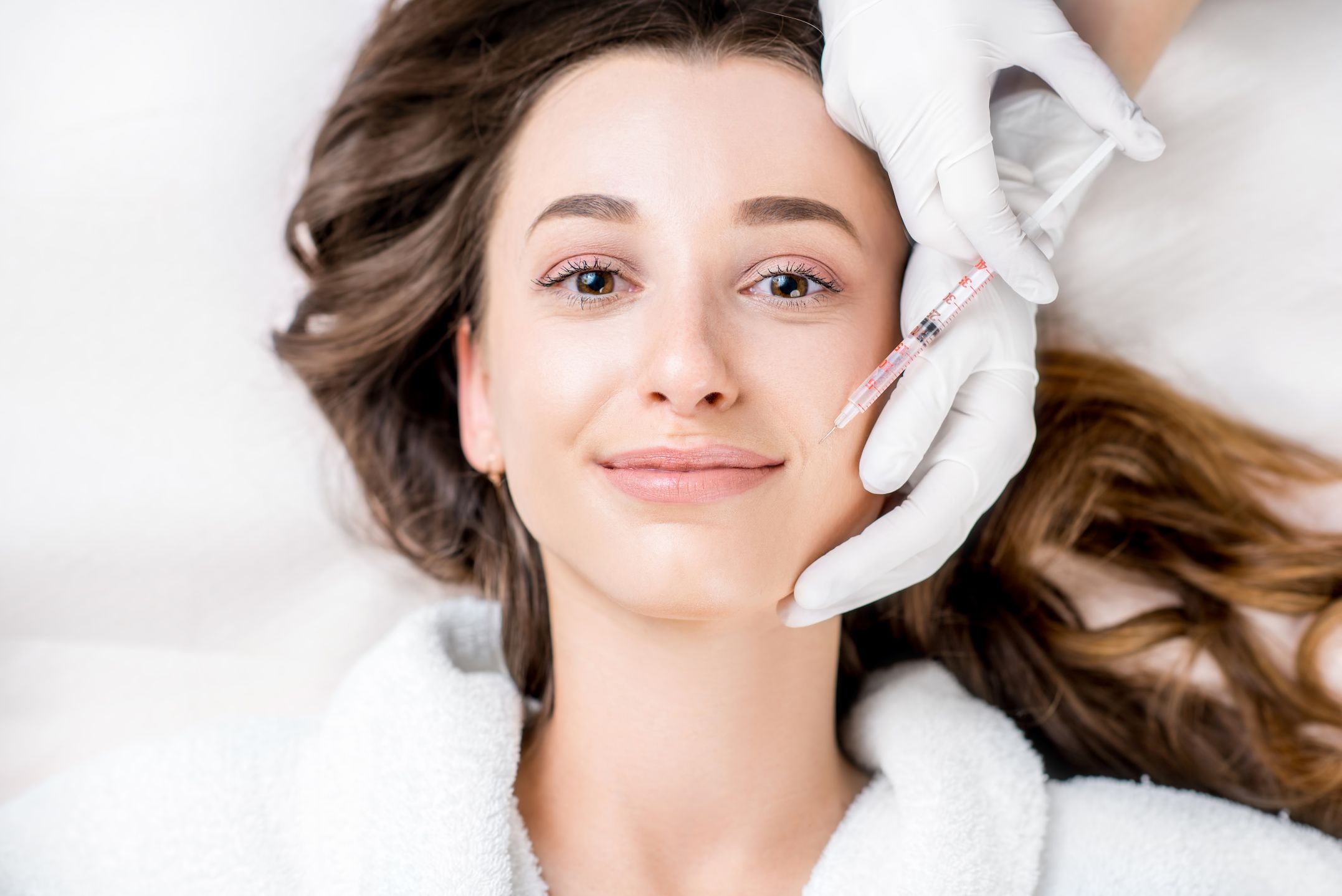 Woman receiving anti-wrinkle injection